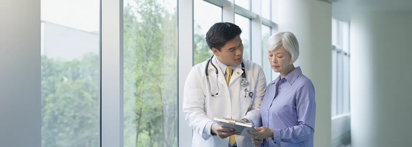 Cardiologist explaining heart rate results to patient during a consultation at Gleneagles Hospital.