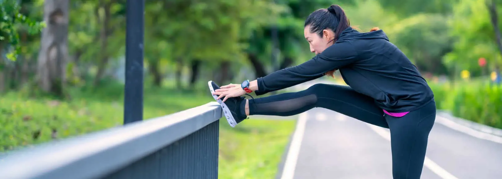 Woman stretching her leg to prevent plantar fasciitis