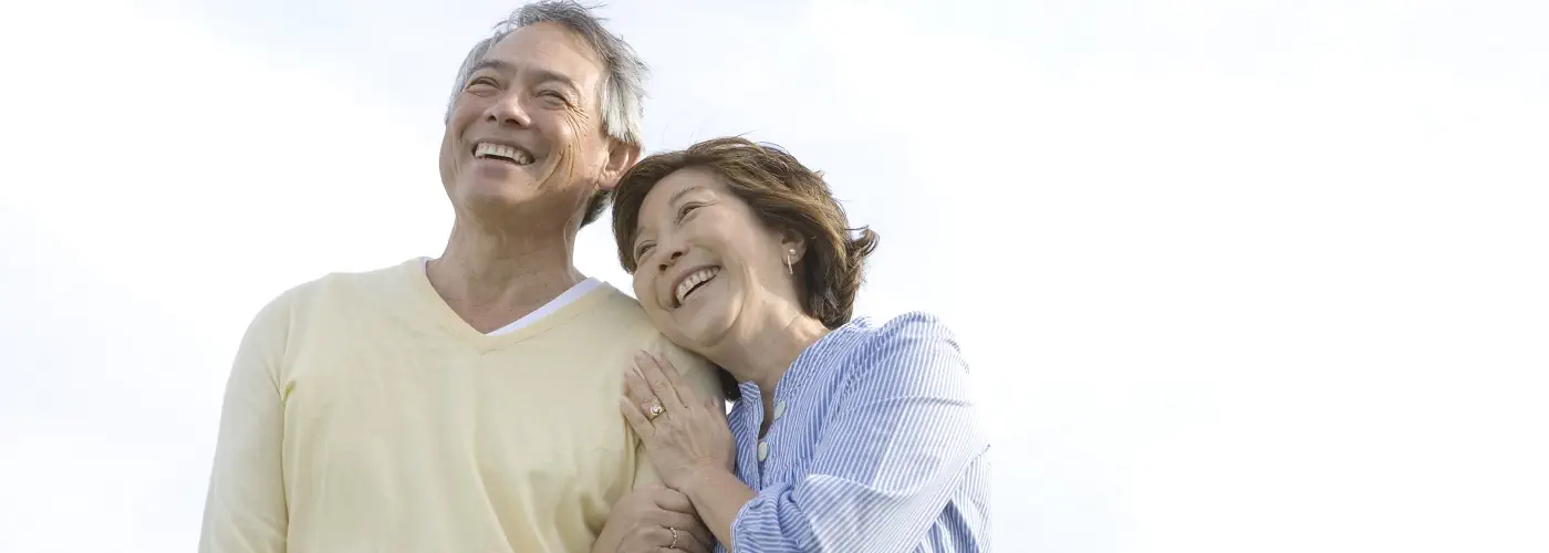 Senior couple smiling after successful rheumatology treatment