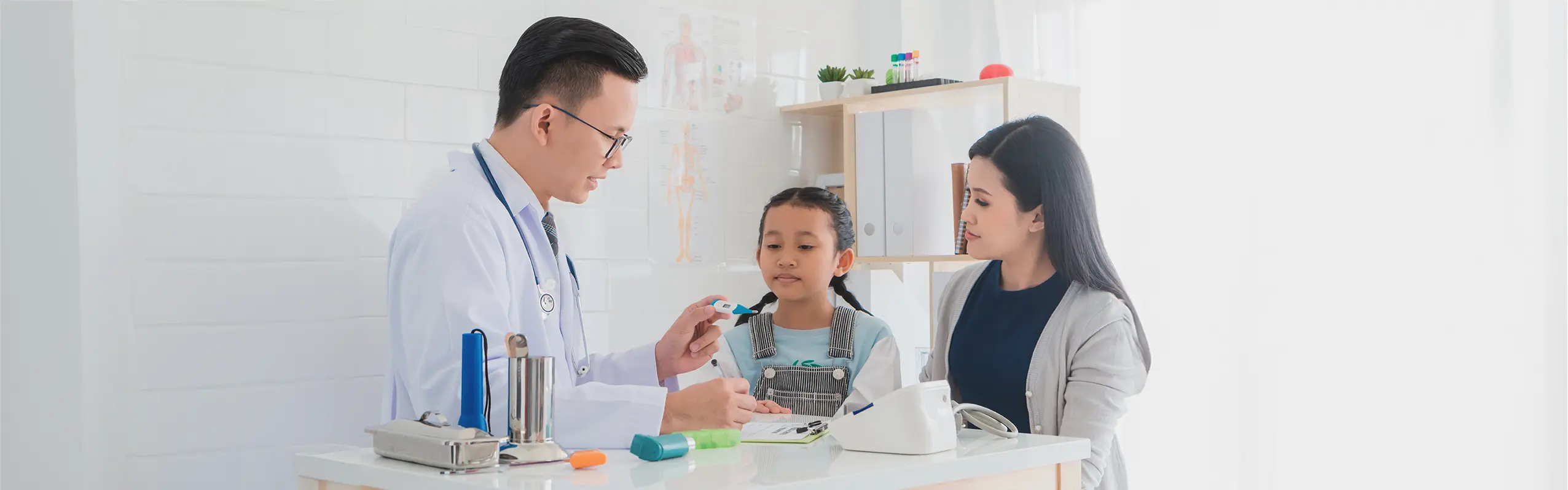 Doctor checking a child's temperature