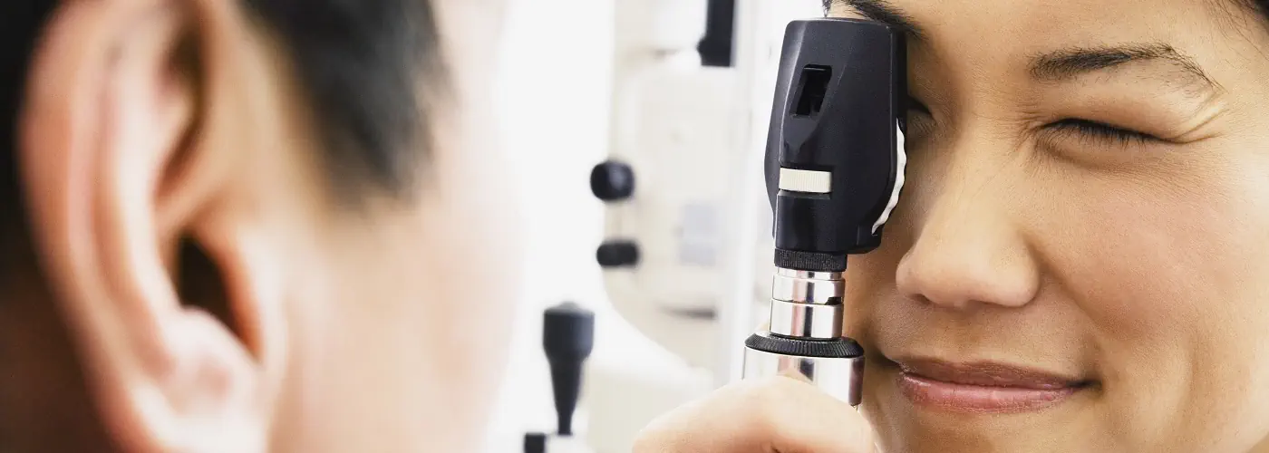 Ophthalmologist examining a patient's eye